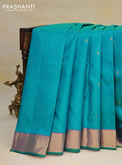 Pure kanchipuram silk saree dual shade of teal green and dual shade of purple with zari woven buttas and rich zari woven border