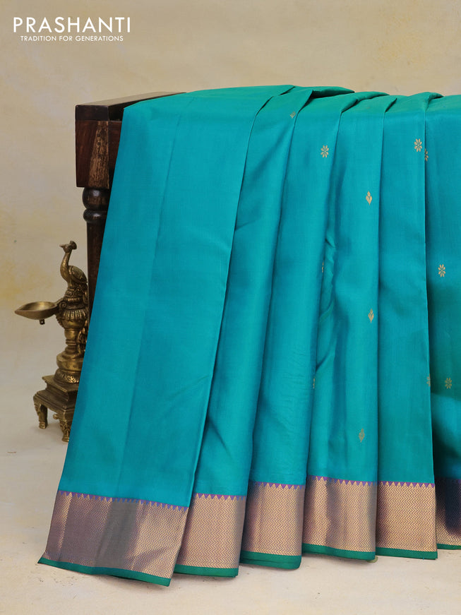 Pure kanchipuram silk saree dual shade of teal green and dual shade of purple with zari woven buttas and rich zari woven border