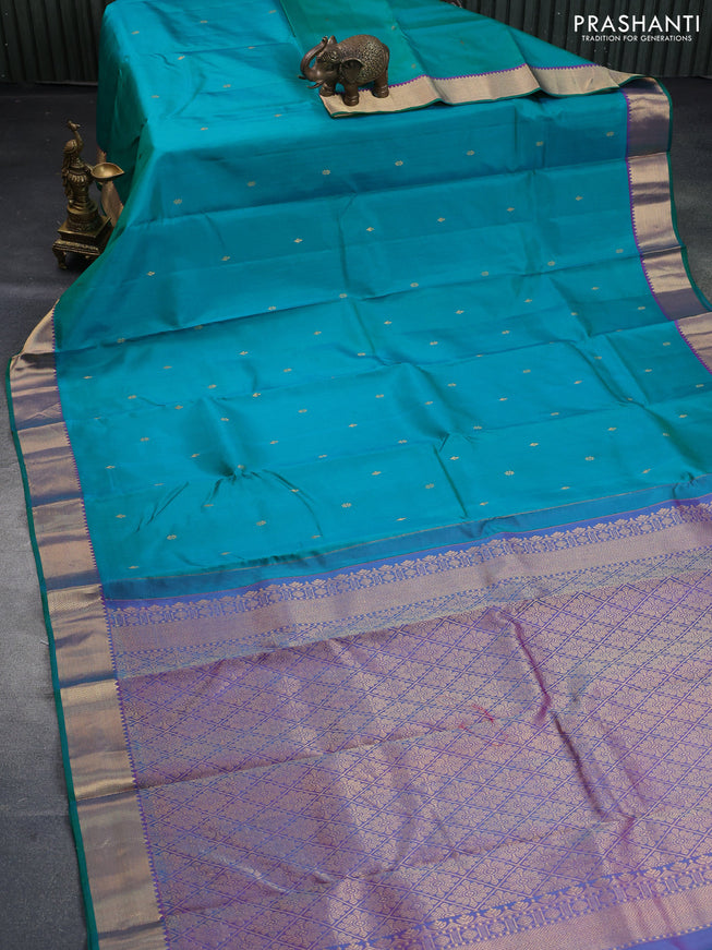 Pure kanchipuram silk saree dual shade of teal green and dual shade of purple with zari woven buttas and rich zari woven border