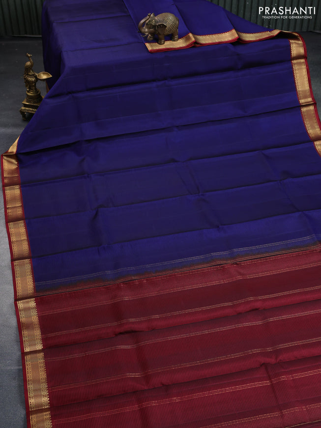 Pure kanchipuram silk saree dark blue and maroon with allover stripe pattern and zari woven border