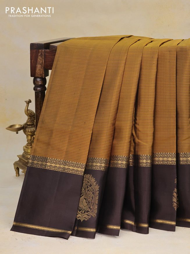 Pure kanchipuram silk saree mustard yellow and coffee brown with allover stripes pattern and zari woven butta border