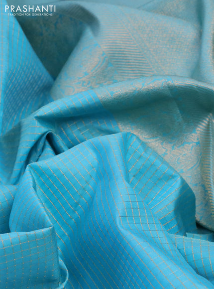 Pure kanchipuram silk saree light blue with allover small zari checked pattern and zari woven border