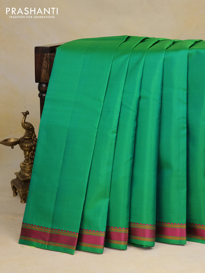 Pure kanchipuram silk saree green with plain body and thread woven border