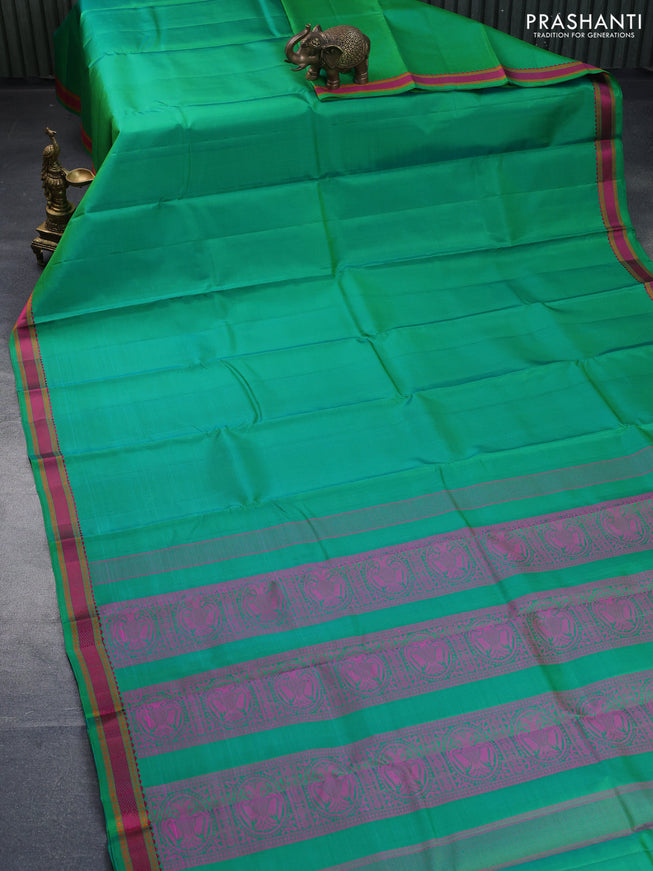 Pure kanchipuram silk saree green with plain body and thread woven border