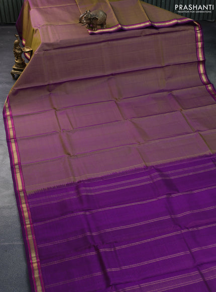 Pure kanchipuram silk saree dual shade of sap green and purple with allover stripes pattern and zari woven border