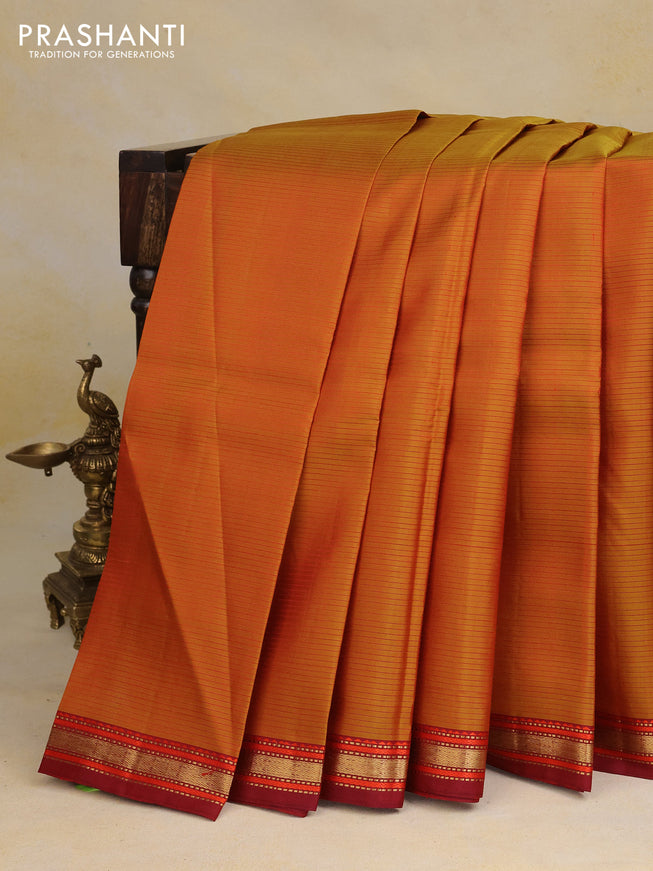 Pure kanchipuram silk saree dual shade of mustard and maroon with allover stripes pattern and zari woven border