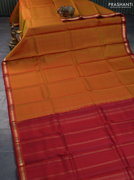 Pure kanchipuram silk saree dual shade of mustard and maroon with allover stripes pattern and zari woven border