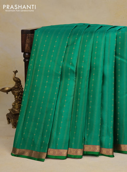 Pure kanchipuram silk saree green with allover zari weaves and zari woven border