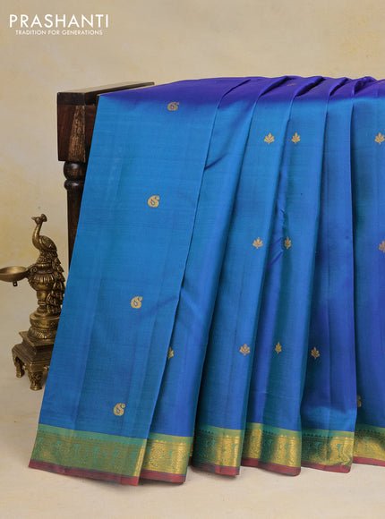 Pure kanchipuram silk saree dual shade of bluish green and red with zari woven buttas and zari woven border