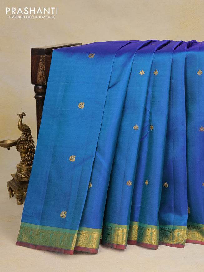 Pure kanchipuram silk saree dual shade of bluish green and red with zari woven buttas and zari woven border