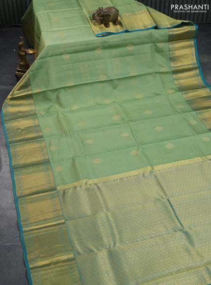 Pure kanchipuram silk saree pastel green and teal green with allover zari weaves & buttas and long zari woven border