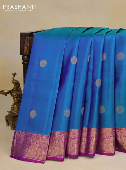 Pure kanchipuram silk saree dual shade of bluish green and purple with zari woven buttas and rich zari woven border