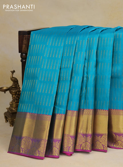 Pure kanchipuram silk saree teal blue and purple with allover zari woven butta weaves and rich zari woven border