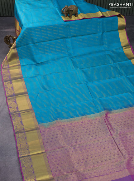 Pure kanchipuram silk saree teal blue and purple with allover zari woven butta weaves and rich zari woven border