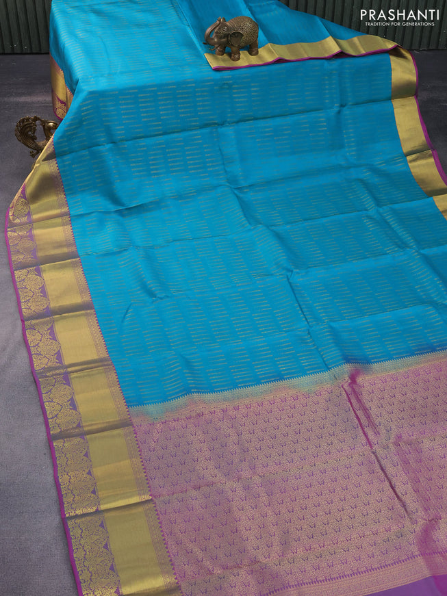 Pure kanchipuram silk saree teal blue and purple with allover zari woven butta weaves and rich zari woven border