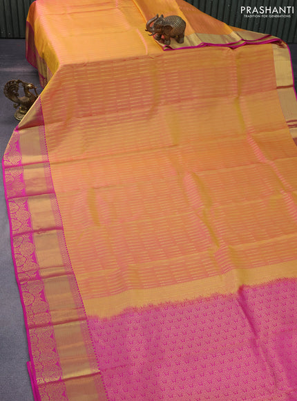 Pure kanchipuram silk saree dual shade of yellowish pink and pink with allover zari woven butta weaves and rich zari woven border