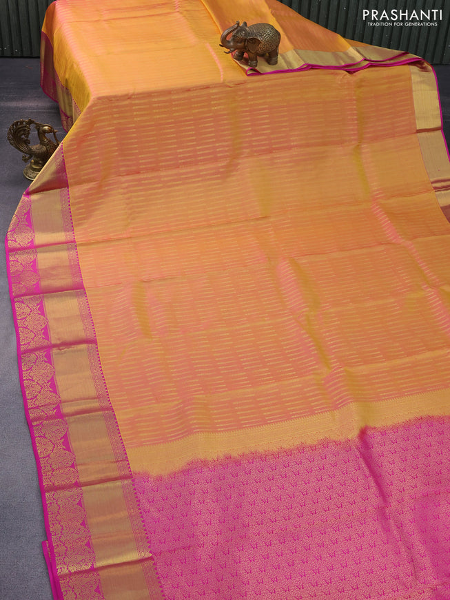 Pure kanchipuram silk saree dual shade of yellowish pink and pink with allover zari woven butta weaves and rich zari woven border