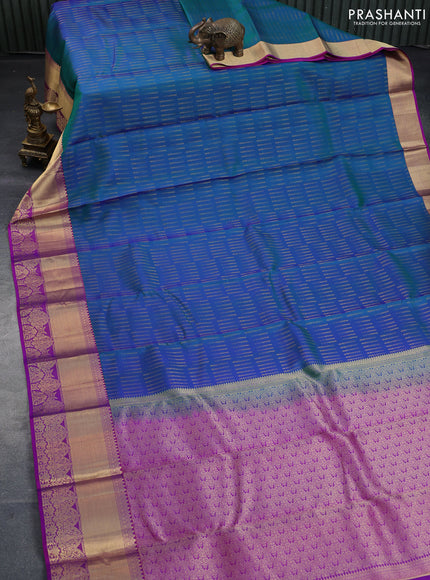 Pure kanchipuram silk saree dual shade of bluish green and purple with allover zari woven butta weaves and rich zari woven border