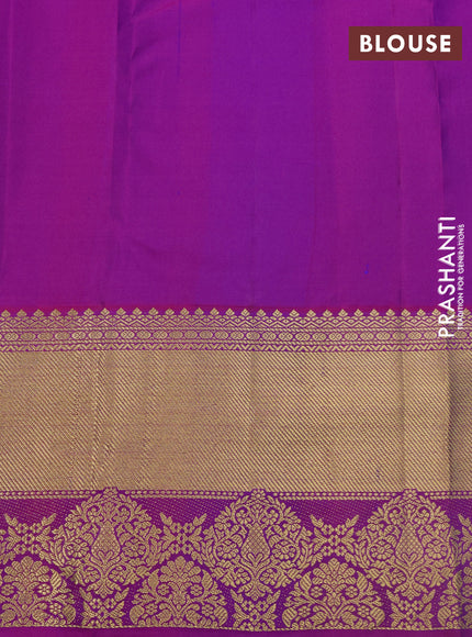 Pure kanchipuram silk saree dual shade of bluish green and purple with allover zari woven butta weaves and rich zari woven border