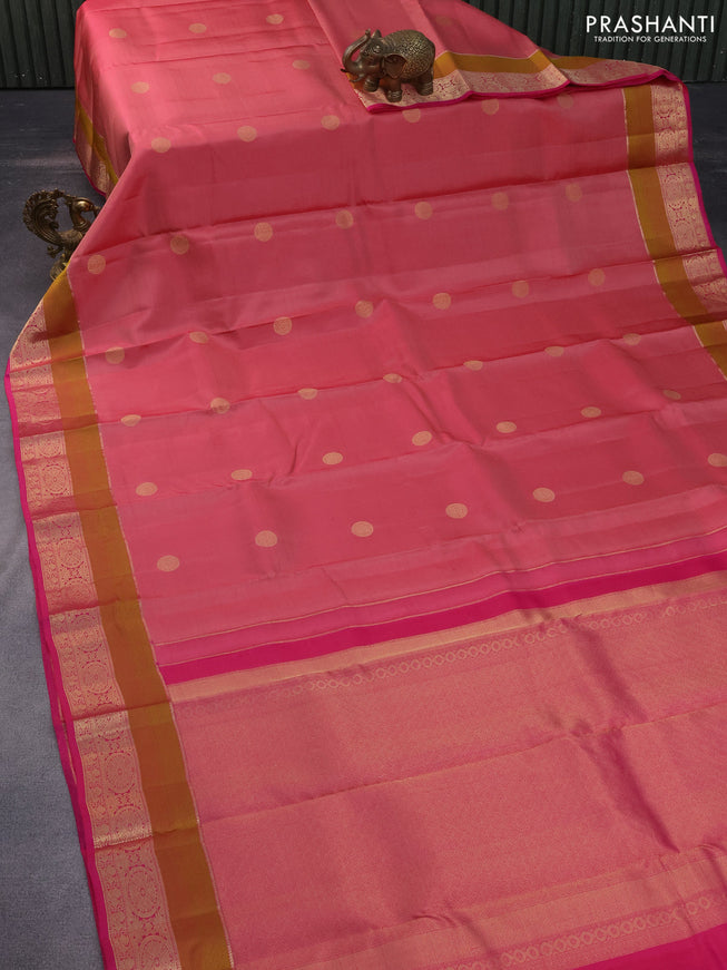 Pure kanchipuram silk saree peach pink shade and pink with allover zari woven buttas and rich zari woven border