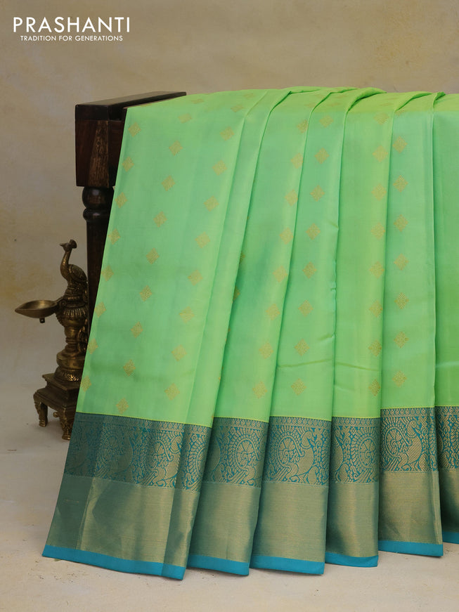 Pure kanchipuram silk saree light green and teal blue with zari woven buttas and annam zari woven border