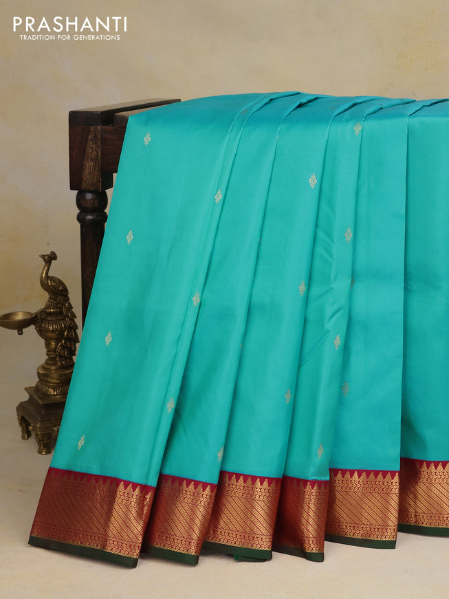 Pure kanchipuram silk saree light blue and maroon with zari woven buttas and zari woven korvai border