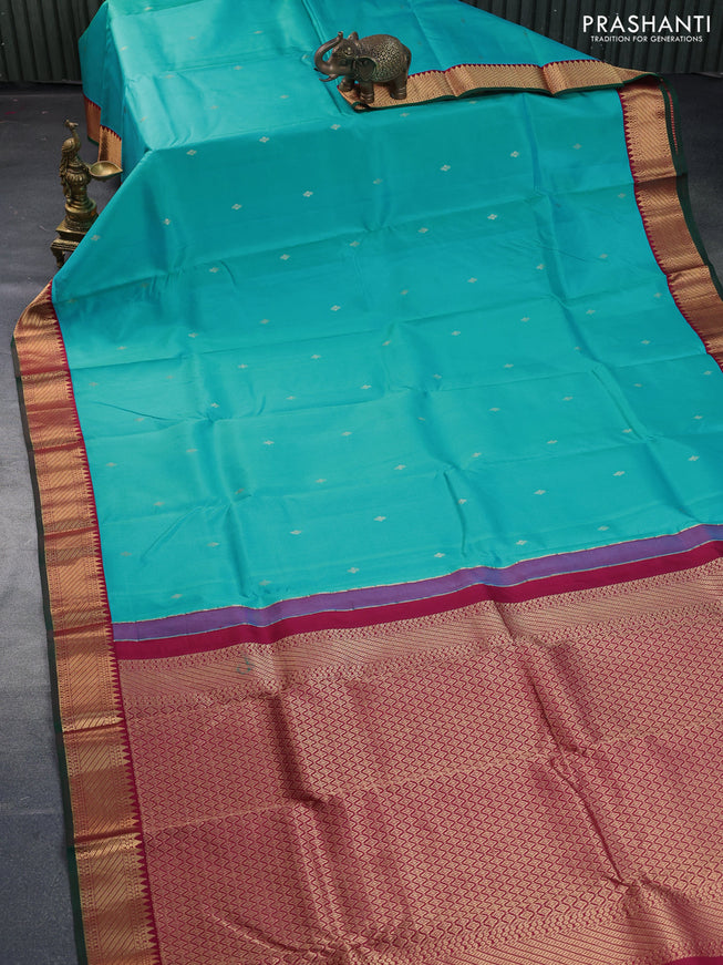 Pure kanchipuram silk saree light blue and maroon with zari woven buttas and zari woven korvai border