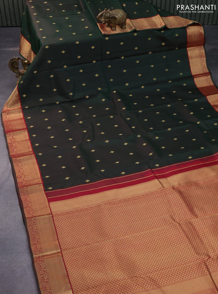 Pure kanchipuram silk saree dual shade of bottle green and maroon with zari woven buttas and zari woven korvai border