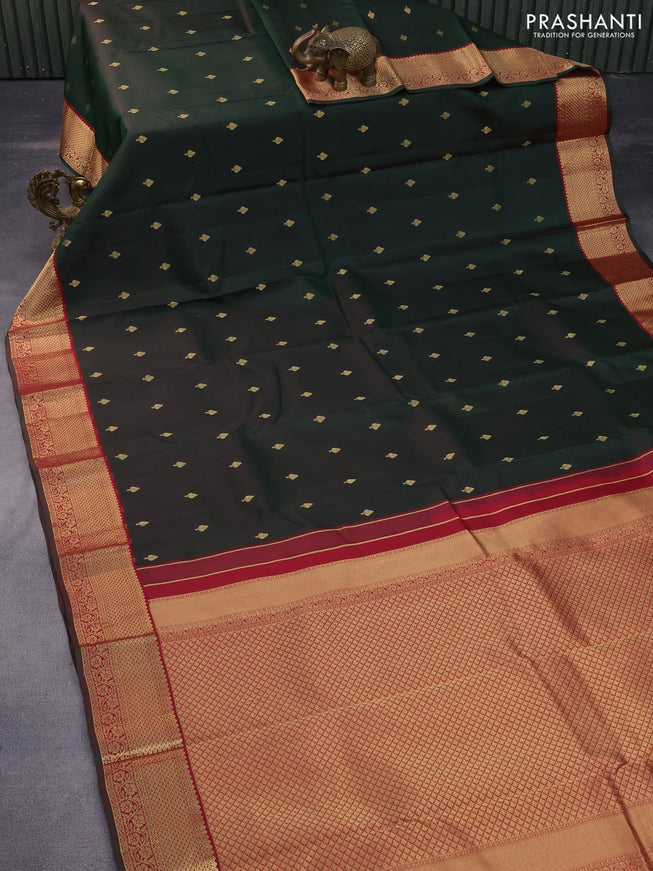 Pure kanchipuram silk saree dual shade of bottle green and maroon with zari woven buttas and zari woven korvai border