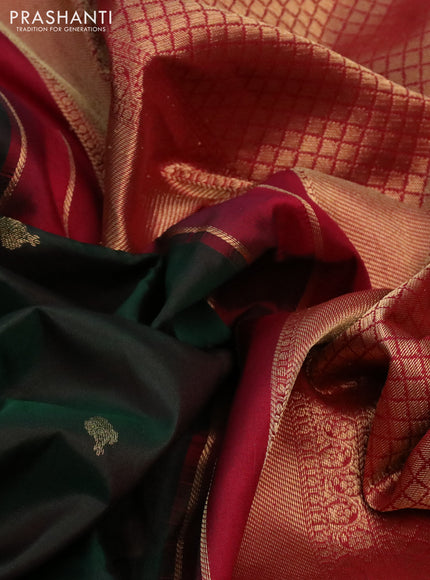 Pure kanchipuram silk saree dual shade of bottle green and maroon with zari woven buttas and zari woven korvai border