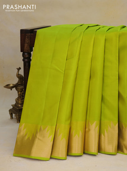 Pure kanchipuram silk saree flourescent green with plain body and temple zari woven border