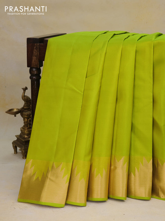 Pure kanchipuram silk saree flourescent green with plain body and temple zari woven border