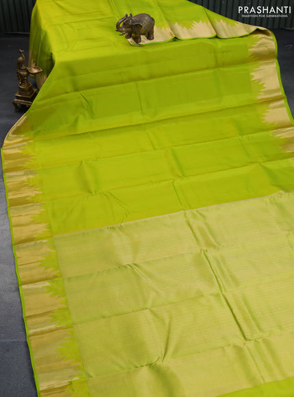 Pure kanchipuram silk saree flourescent green with plain body and temple zari woven border