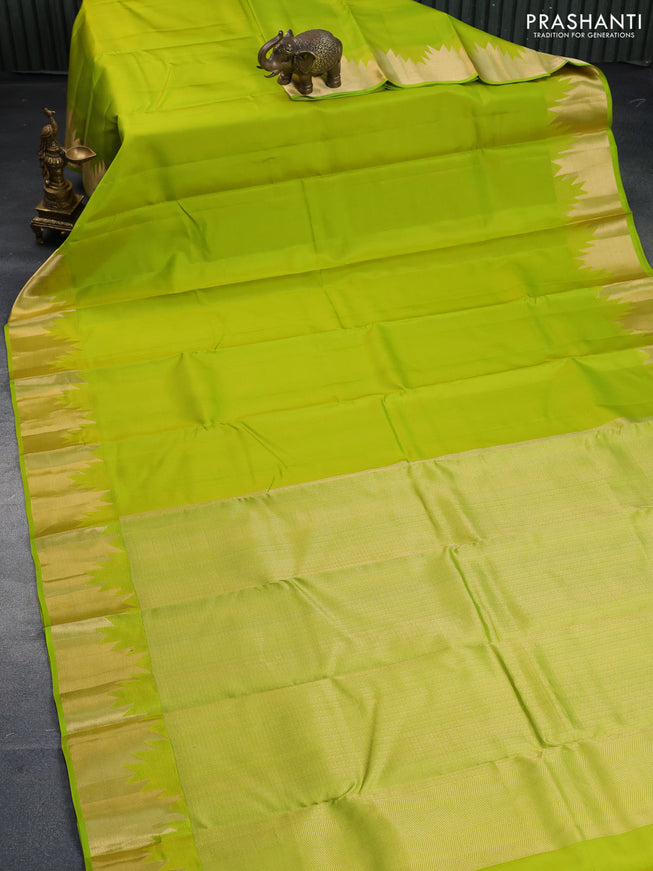 Pure kanchipuram silk saree flourescent green with plain body and temple zari woven border