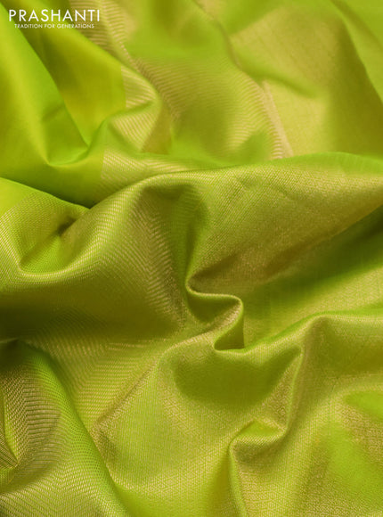 Pure kanchipuram silk saree flourescent green with plain body and temple zari woven border