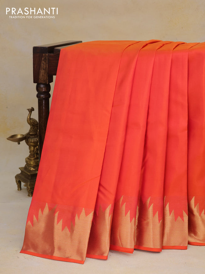 Pure kanchipuram silk saree dual shade of pinkish orange with plain body and temple zari woven border