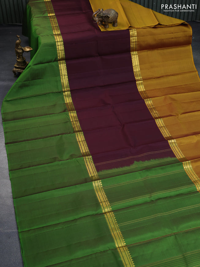 Pure kanchipuram silk saree deep maroon mustard yellow and green with plain body and ganga jamuna border