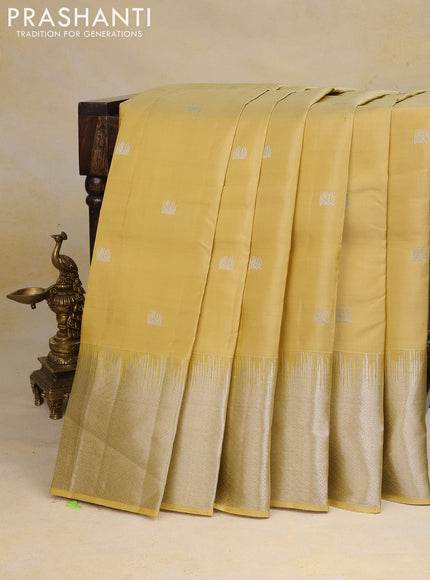 Pure kanchipuram silk saree pale yellow with silver zari woven buttas and silver zari woven border