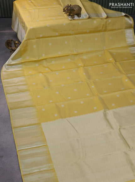 Pure kanchipuram silk saree pale yellow with silver zari woven buttas and silver zari woven border