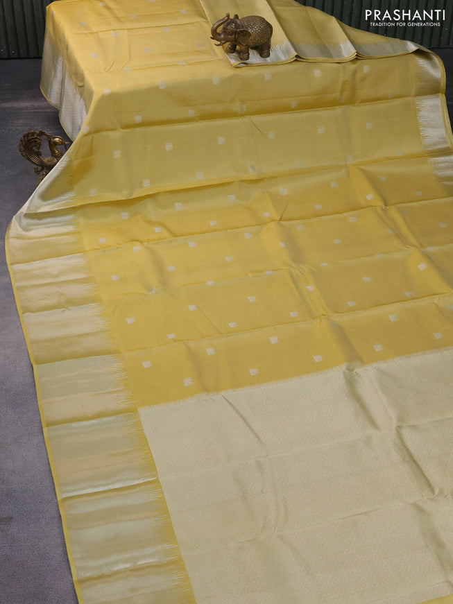 Pure kanchipuram silk saree pale yellow with silver zari woven buttas and silver zari woven border