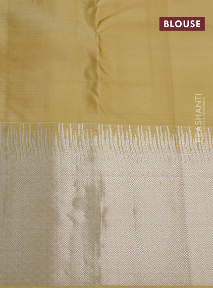 Pure kanchipuram silk saree pale yellow with silver zari woven buttas and silver zari woven border