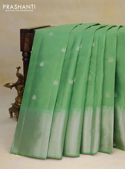 Pure kanchipuram silk saree pastel green with silver zari woven buttas and long silver zari woven border