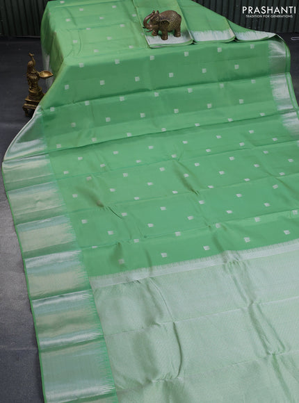 Pure kanchipuram silk saree pastel green with silver zari woven buttas and long silver zari woven border