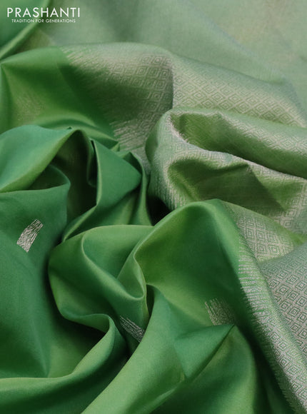 Pure kanchipuram silk saree pastel green with silver zari woven buttas and long silver zari woven border