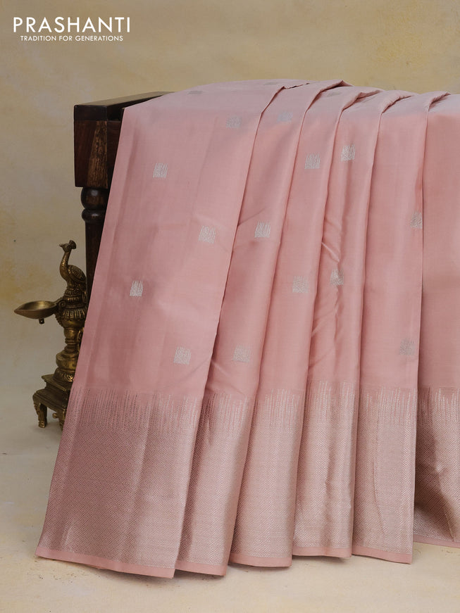 Pure kanchipuram silk saree pastel peach shade with silver zari woven buttas and long silver zari woven border