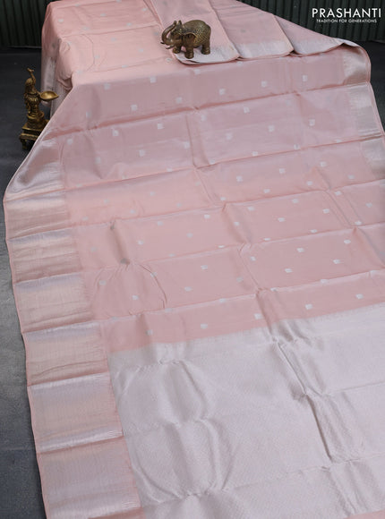 Pure kanchipuram silk saree pastel peach shade with silver zari woven buttas and long silver zari woven border