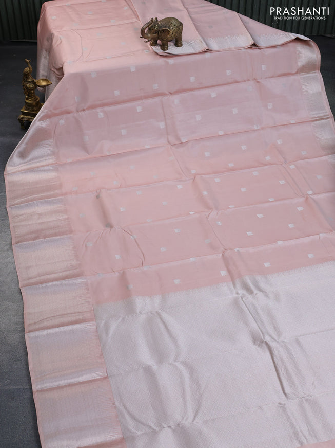 Pure kanchipuram silk saree pastel peach shade with silver zari woven buttas and long silver zari woven border