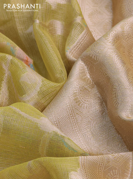 Cotton zari kota tissue saree light green and red with allover zari weaves and zari woven muniya butta border