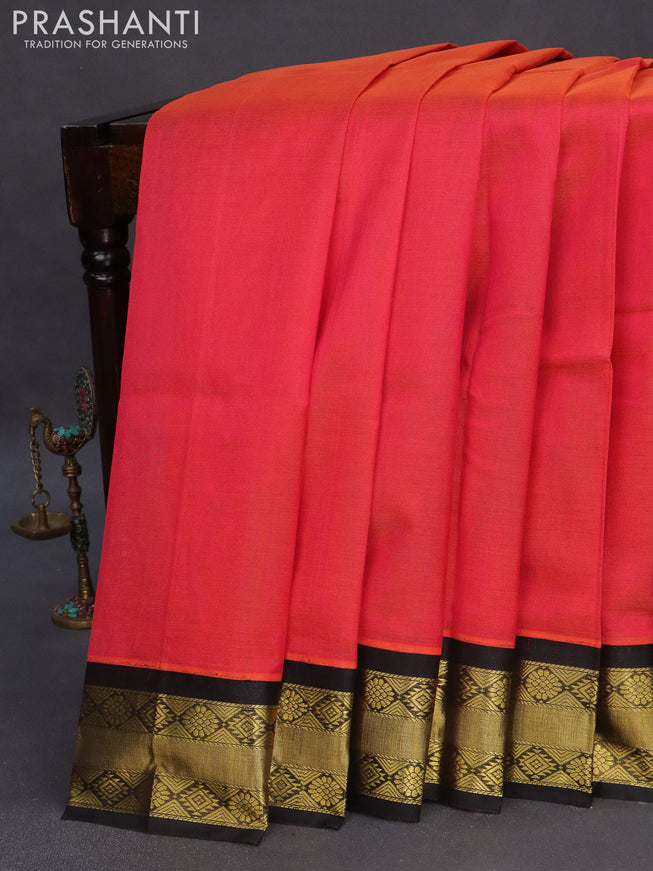 Kuppadam silk cotton saree dual shade of pinkish orange and black with plain body and zari woven border