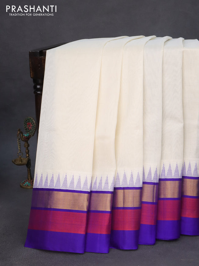 Kuppadam silk cotton saree off white and blue with plain body and temple design zari woven border